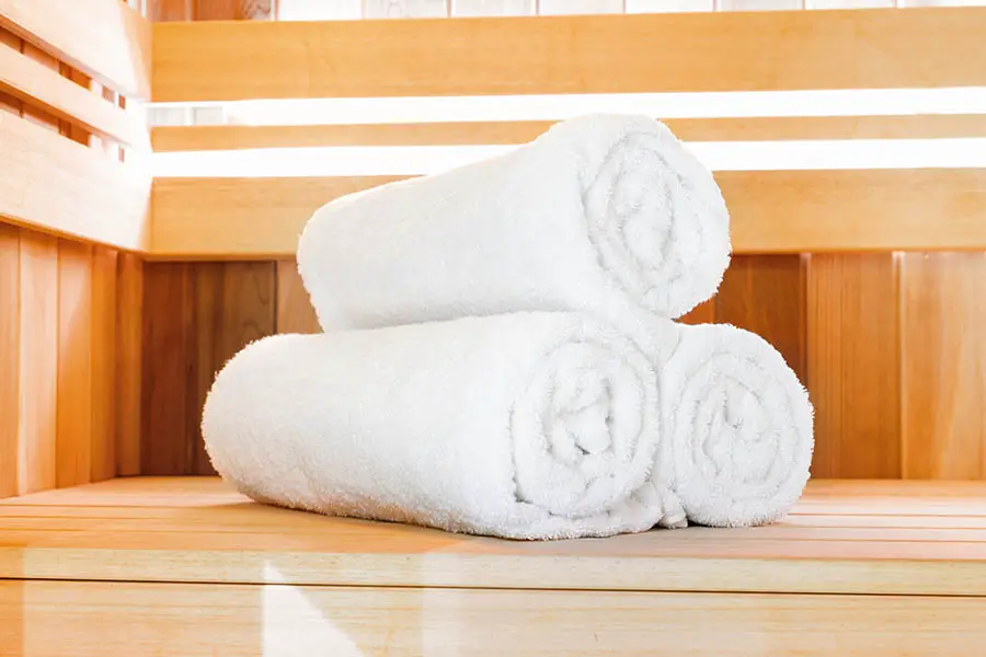 Sauna with 3 rolled up towels