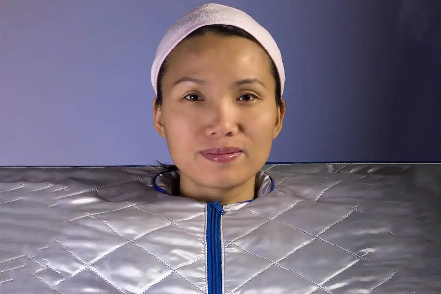 Woman in a portable sauna suit