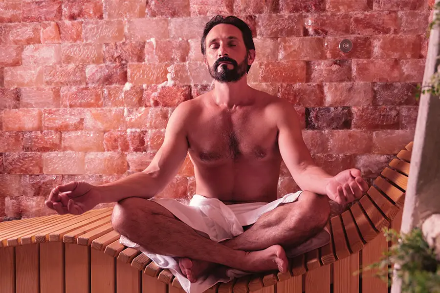 Bearded Man Meditating in the Sauna