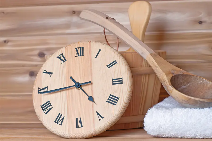 Sauna with a Clock, Bucket, and Scoop