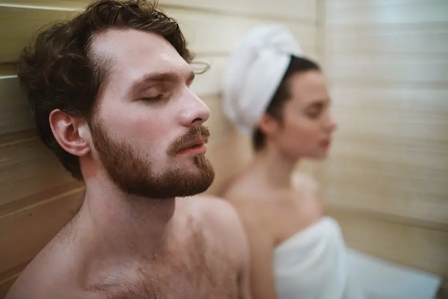 Man and Woman Relaxing in a Sauna
