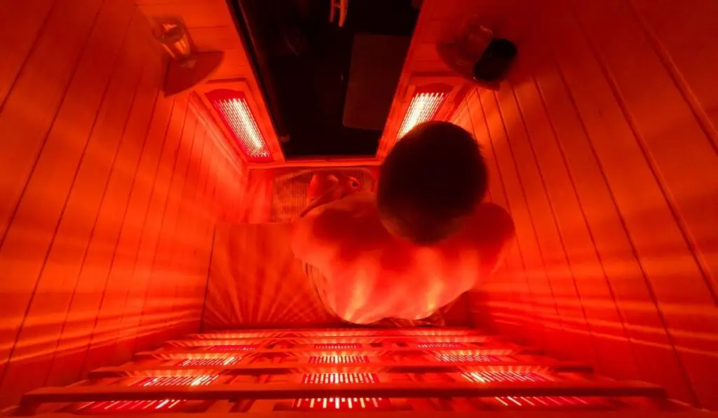 Man relaxing in a luxury infrared sauna