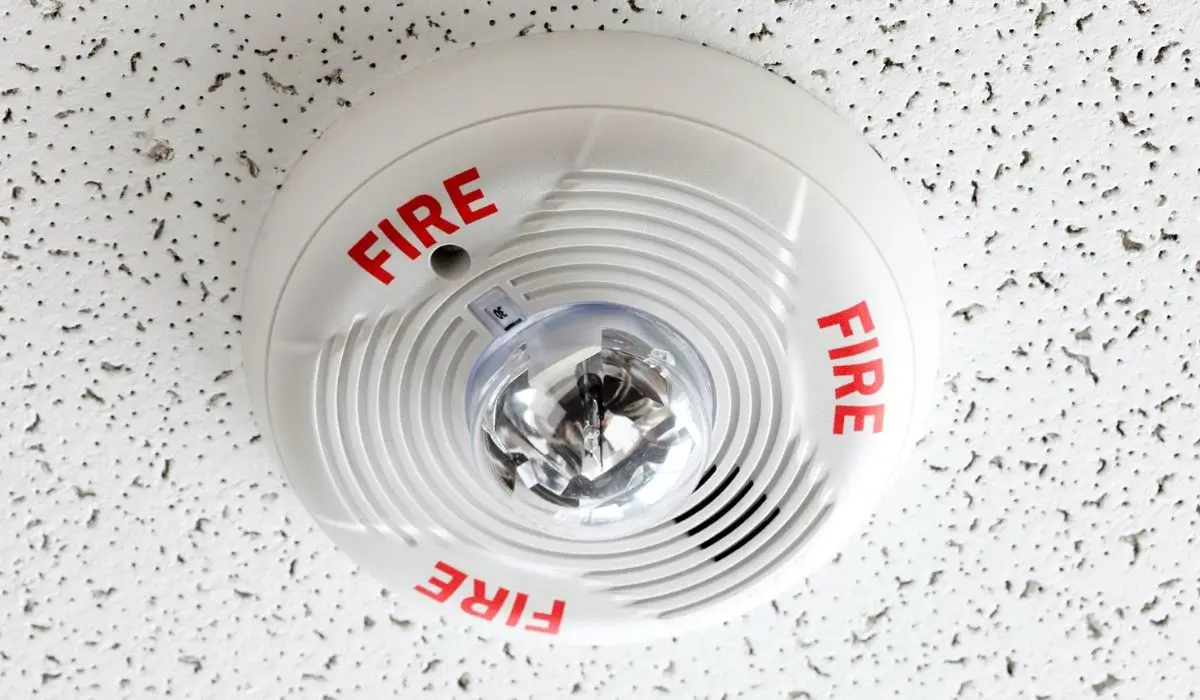 A white ceiling mounted Fire Alarm