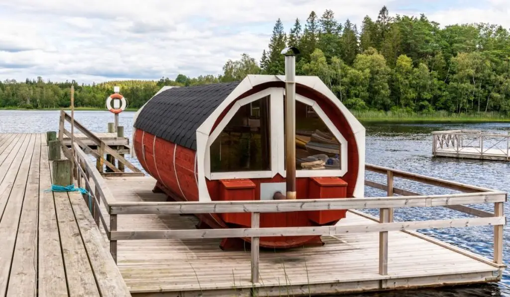 Traditional Scandinavian water floating red wooden sauna