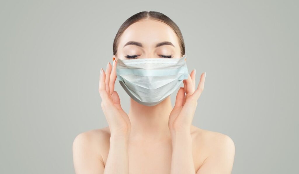 Healthy model woman in protective mask